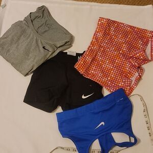 Bundle of 4 pieces Nike and under armor work out clothes.